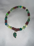 Green leaf clay and glass bead bracelet